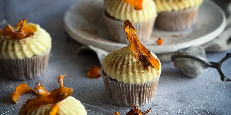 Cupcakes Unwrapped: The Sweet Origins & Scrumptious Recipes