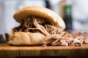 Succulent Pulled Pork with Apple Sauce in Soft White Bread Roll