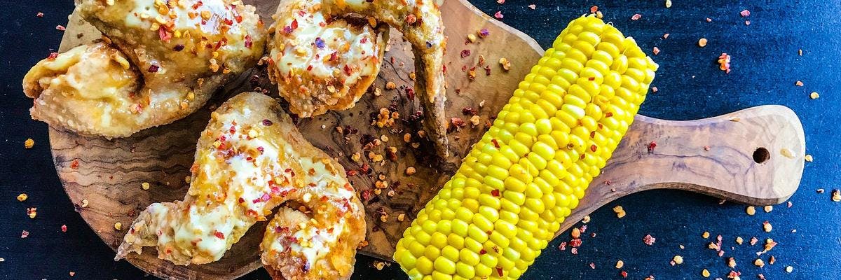 Chilli Butter Chicken Legs with Juicy Corn on the Cob recipe