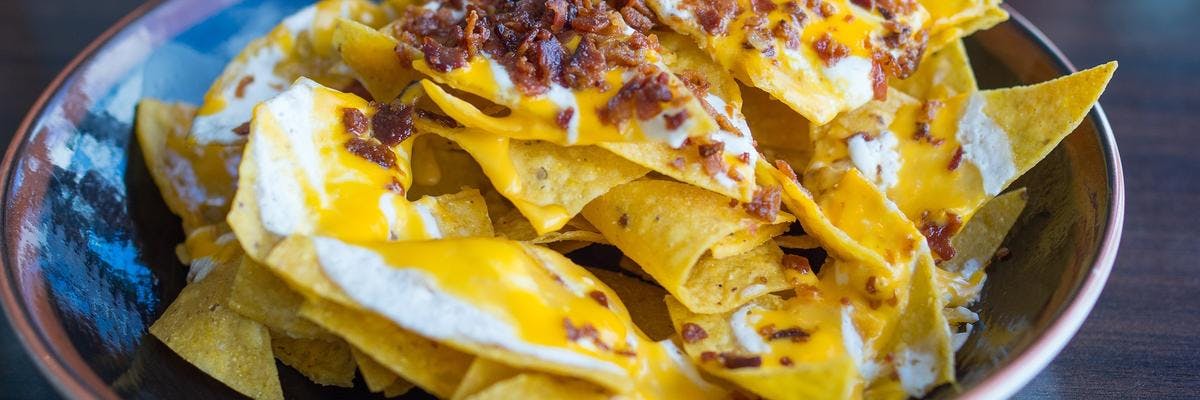 Tortilla Chips with Creamy Nacho Cheese & Bacon Crunch Topping recipe