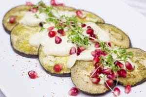 Grilled Aubergine topped with Cream & Pomegranate Seeds