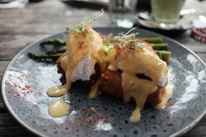 Eggs Benedict on Hashbrowns with Grilled Asparagus