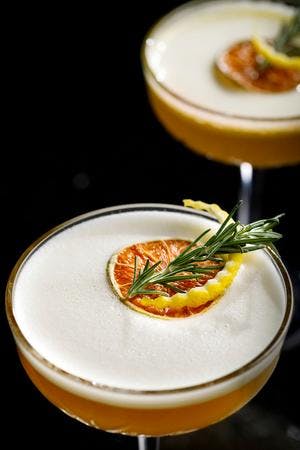 Bitter Citrus Cocktail with Rosemary Garnish